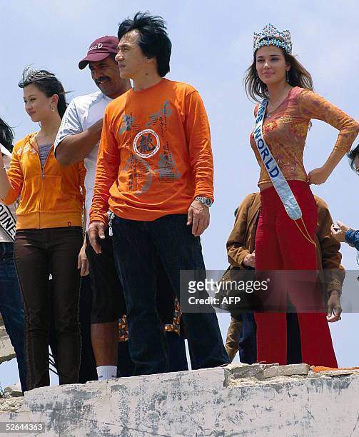 Hong Kong action film hero Jackie Chan , British Olympic gold medalist Daley Thompson and last year's Miss World Julia Garcia Mantilla of Peru stand...
