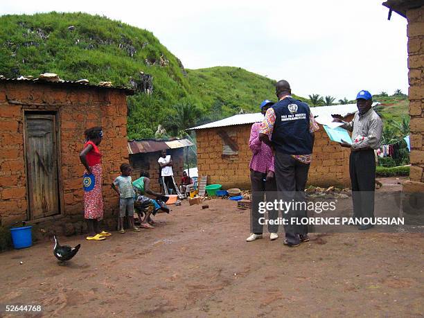 World health Organization epidemic specialists visit a shanty town after an outbreak of the deadly Marburg virus in Angola 10 April 2005, in Uige....