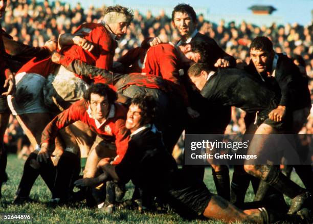 Gareth Edwards of the British Lions is tackled by New Zealand's Alan McNaughton during a test match on the British Lions Tour to New Zealand in 1971.