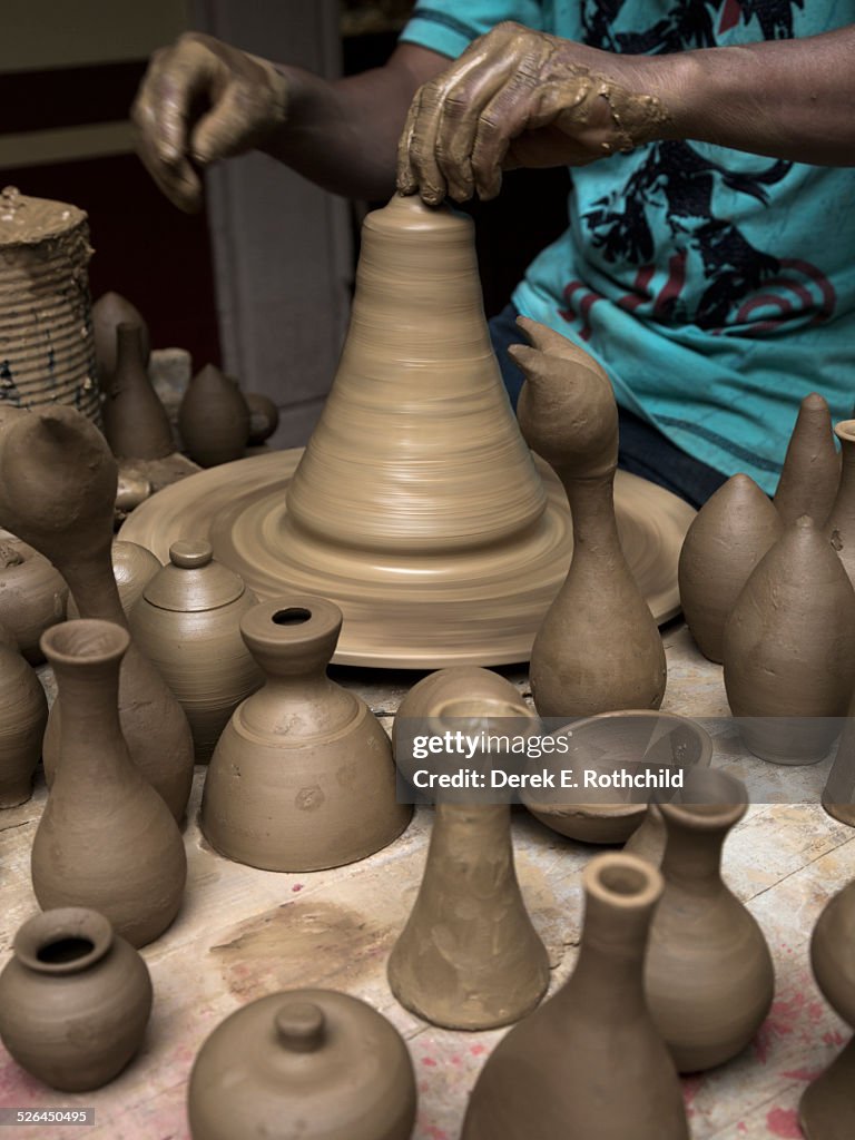 Artisan crafting clay pots