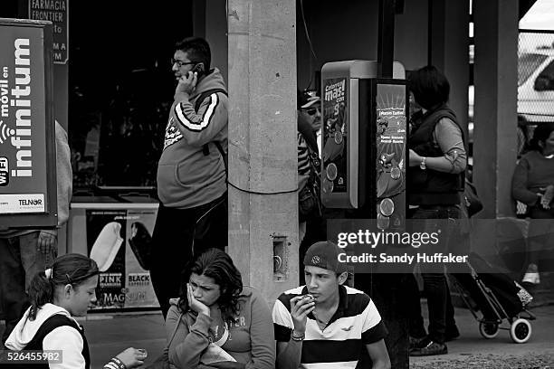 Pedestrians wait in line to cross the U.S.-Mexico border in Tijuana, Mexico on Sunday, March 3, 2013. Due to the recent Sequestration cuts, Customs...