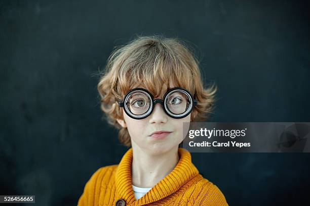 boy wearing novelty glasses - miope and humor fotografías e imágenes de stock
