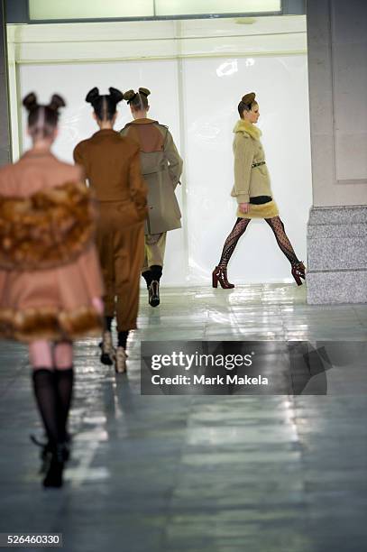 Models exhibit the Unique autumn 2011 collection at the TS Venue in London on 20 February 2011.