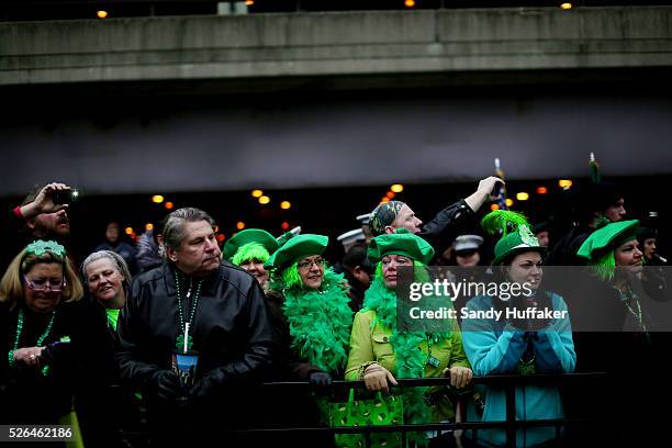 People watch the festivities, dressed in Irish themed costumes, during a St Patricks Day paraden in Chicago, IL on Saturday, March 16, 2013. There...