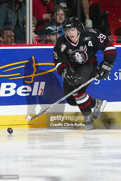 Chris Neiszner of the Red Deer Rebels skates with the puck against the Vancouver Giants at Pacific Coliseum on February 16, 2005 in Vancouver,...