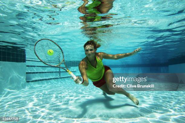 Rising tennis star, 17-year old Tatiana Golovin of France plays tennis underwater at the Ocean Club on April 1, 2005 on Key Biscayne in Miami,...