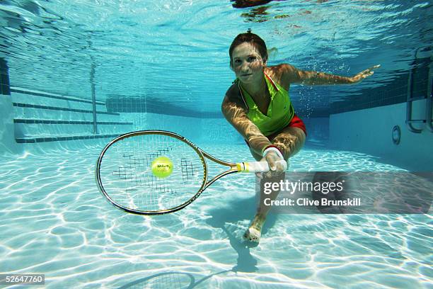 Rising tennis star, 17-year old Tatiana Golovin of France plays tennis underwater at the Ocean Club on April 1, 2005 on Key Biscayne in Miami,...