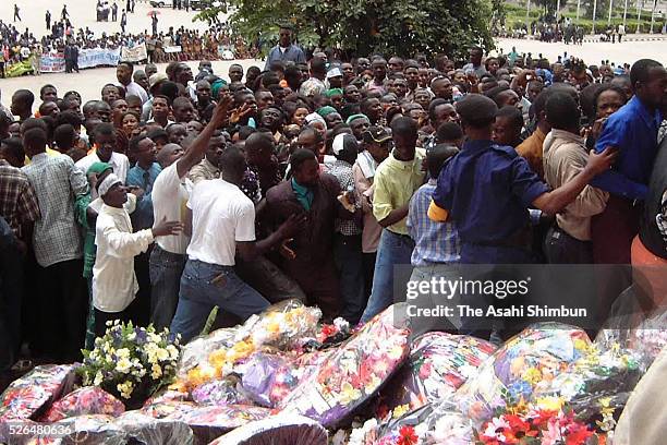 People gather as the funeral of assassinated President Laurent-Desire Kabila is held on January 23, 2001 in Kinshasa, Democratic Republic of Congo.