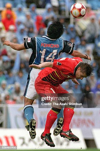 Takahiro Yamanishi of Jubilo Iwata and Dragan Stojkovic of Nagoya Grampus Eight compete for the ball during the J.League match between Jubilo Iwata...