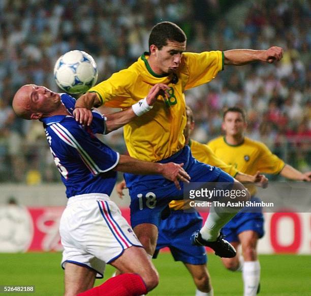 Frank Leboeuf of France and Fabio Rochemback of Brazil compete for the ball during the Confederations Cup semi final match between France and Brazil...