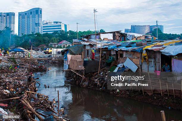 Slum area in Jakarta. In just three generations, the population has exploded from 2 million to 13 million people, in suburbs. Many of the poorest...