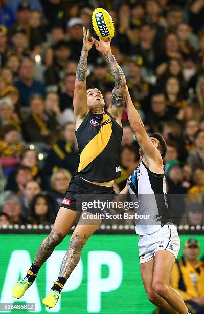 Dustin Martin of the Tigers marks the ball during the round six AFL match between the Richmond Tigers and the Port Adelaide Power at Melbourne...