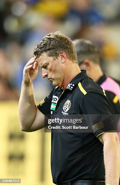 Damien Hardwick, coach of the Tigers leaves the field after speaking to his team during the round six AFL match between the Richmond Tigers and the...