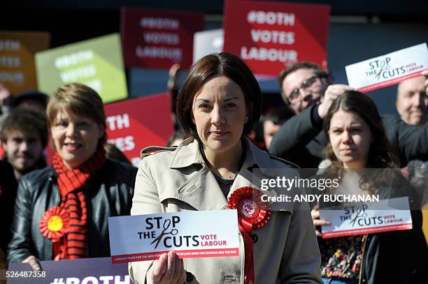 Scottish Labour leader Kezia Dugdale unveils a new election campaign poster on Leith Walk in Edinburgh on April 30, 2015. Scotland will elect a new...