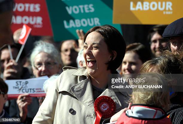 Scottish Labour leader Kezia Dugdale smiles as she unveils a new election campaign poster on Leith Walk in Edinburgh on April 30, 2015. Scotland will...