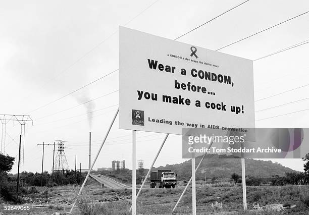 Sign warning miners about the dangers of HIV/AIDS at the Lonmin platinum mine in the Marikana area of South Africa. 17,000 men work in the mine and...