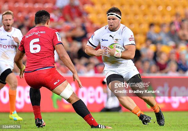 Maks Van Dyk of the Cheetahs looks to take on the defence of Hendrik Tui of the Reds during the round 10 Super Rugby match between the Reds and the...