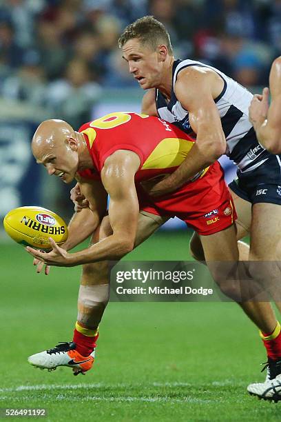 Joel Selwood of the Cats tackles Gary Ablett of the Suns during the round six AFL match between the Geelong Cats and the Gold Coast Suns at Simonds...