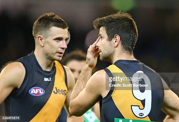 Trent Cotchin and Brett Deledio of the Tigers react at full time after losing the round six AFL match between the Richmond Tigers and the Port...