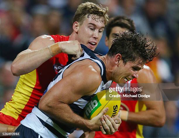 Tom Hawkins of the Cats competes for the ball against Tom Lynch of the Suns during the round six AFL match between the Geelong Cats and the Gold...