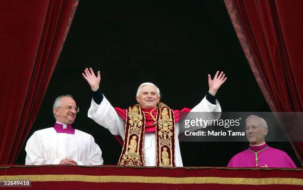 Pope Benedict XVI, Cardinal Joseph Ratzinger of Germany, waves from a balcony of St. Peter's Basilica in the Vatican after being elected by the...