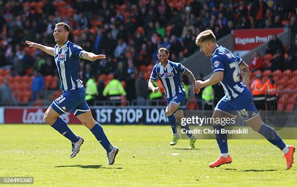 Yanic Wildschut of Wigan Athletic celebrates with team mates as he scores their third goal during the Sky Bet League One match between Blackpool and...