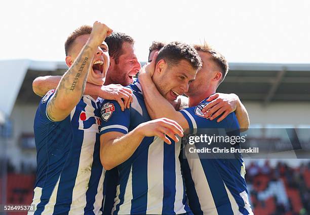 Yanic Wildschut of Wigan Athletic celebrates with team mates as he scores their third goal during the Sky Bet League One match between Blackpool and...