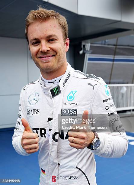 Nico Rosberg of Germany and Mercedes GP celebrates getting pole position in parc ferme during qualifying for the Formula One Grand Prix of Russia at...