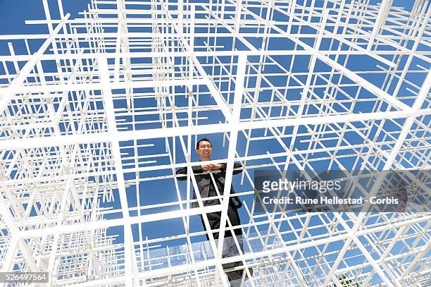 Sou Fujimoto attends a photo call for the new Serpentine Pavilion at the Serpentine Gallery.