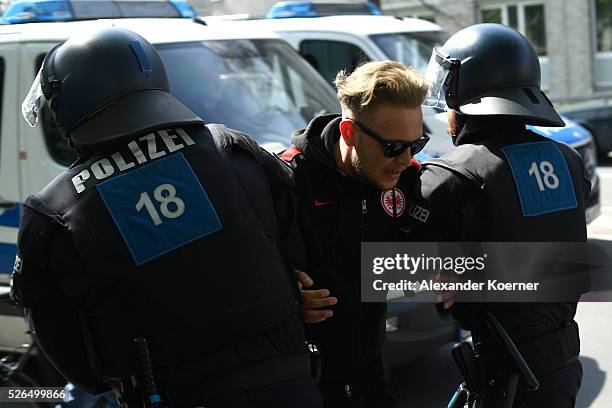 Police forces take a fan of Eintrach Frankfurt into custody prior the Bundesliga Match of SV Darmstadt 98 and Eintracht Frankfurt at "Merck-Stadion...