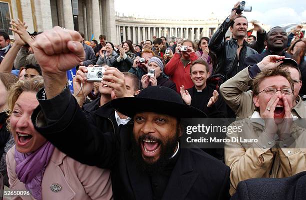 The crowd reacts as German Cardinal Joseph Ratzinger appears on the balcony of St.Peter's Cathedral as Pope Benedict XVI at the end of the second day...