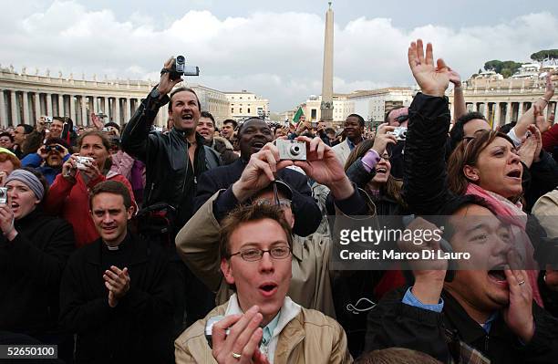 The crowd reacts as German Cardinal Joseph Ratzinger appears on the balcony of St.Peter's Cathedral as Pope Benedict XVI at the end of the second day...