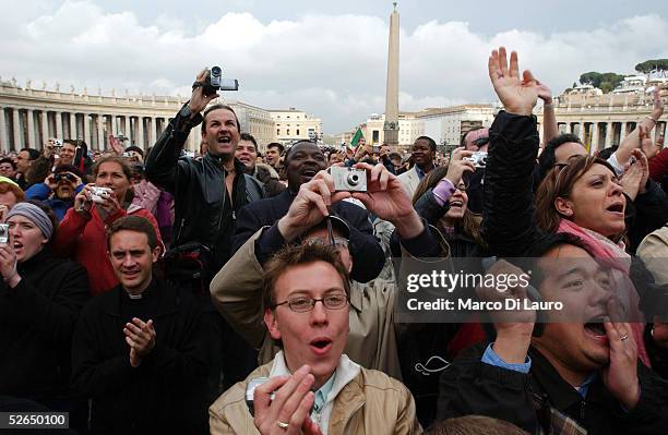 The crowd reacts as German Cardinal Joseph Ratzinger appears on the balcony of St.Peter's Cathedral as Pope Benedict XVI at the end of the second day...