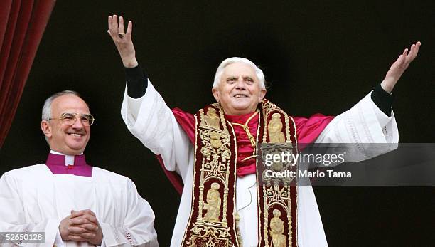 Pope Benedict XVI, Cardinal Joseph Ratzinger of Germany, waves from a balcony after he was elected by the conclave of cardinals April 19, 2005 in...