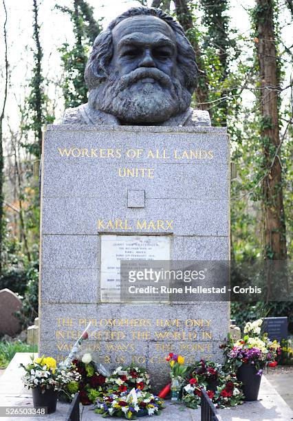 Karl Marx's gravestone in Highgate Cemetery in London .