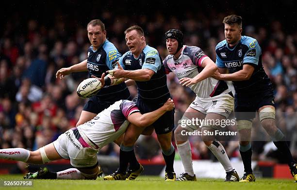 Blues player Matthew Rees offloads during the Guinness Pro 12 match between Cardiff Blues and Ospreys at Principality Stadium on April 30, 2016 in...