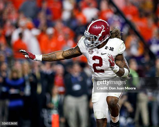 Running back Derrick Henry of the Alabama Crimson Tide gives a Heisman pose after scoring a touchdown during the College Football National...