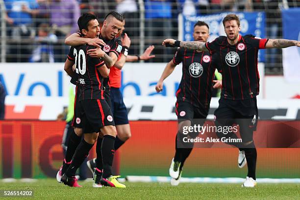 Makoto Hasebe of Frankfurt celebrates his team's first goal with team mates Yanni Regaesel, Szabolcs Huszti and Marco Russ during the Bundesliga...