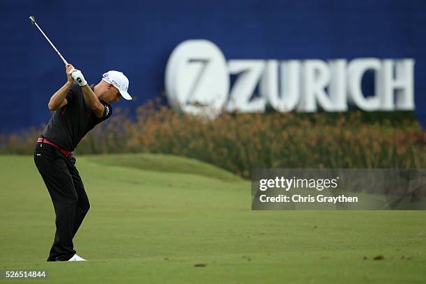 Ben Crane hits his third shot on the 18th hole during the continuaiton of the second round of the Zurich Classic of New Orleans at TPC Louisiana on...