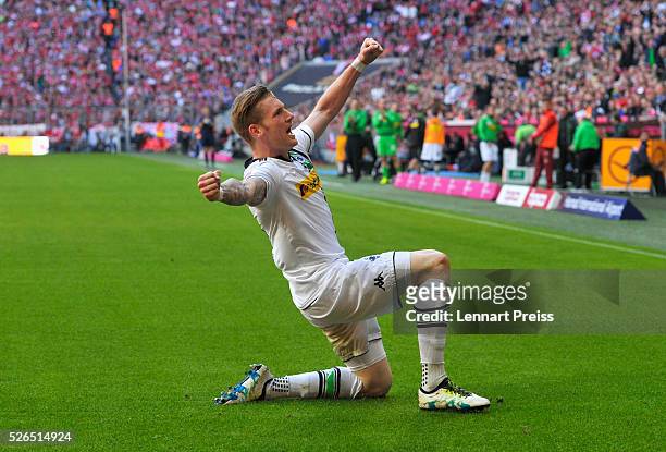 Andre Hahn of Borussia Moenchengladbach celebrates scoring his team's first goal during the Bundesliga match between Bayern Muenchen and Borussia...