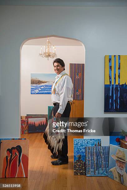 Former national chief of the Assembly of First Nations in Canada at home with his art work that he made. August 21, 2013.