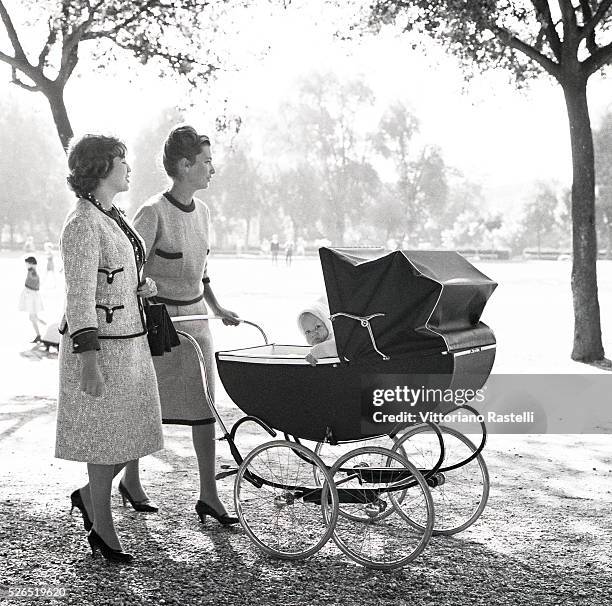 Princess Paola of Belgium pushes the pram of her son Philippe, when he was seven-month-old, at Villa Borghese park, in Rome. Philippe became the King...