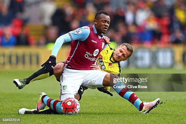 Jordan Ayew of Aston Villa and Almen Abdi of Watford compete for the ball during the Barclays Premier League match between Watford and Aston Villa at...