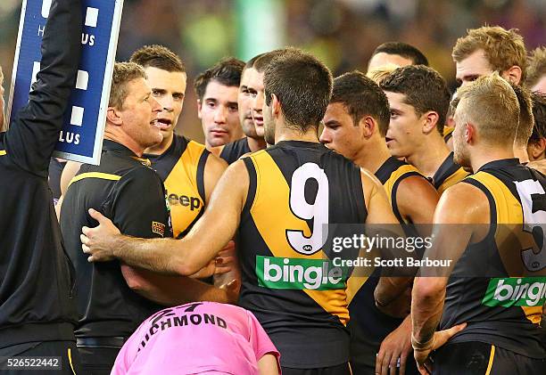 Damien Hardwick, coach of the Tigers speaks to his team during the round six AFL match between the Richmond Tigers and the Port Adelaide Power at...