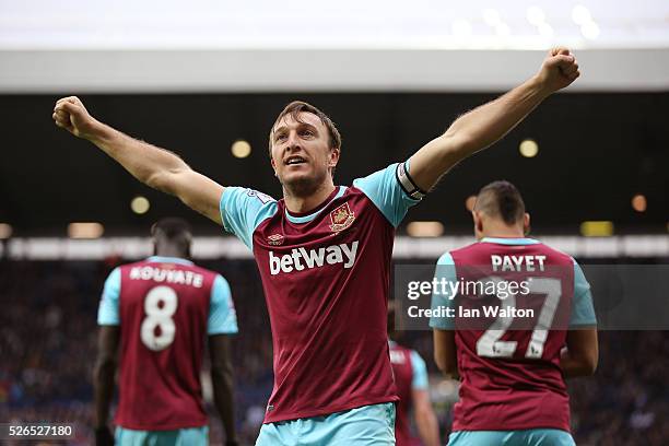 Mark Noble of West Ham United celebrates scoring his team's third goal during the Barclays Premier League match between West Bromwich Albion and West...