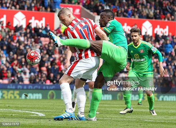 Sunderland's French-born Ivorian defender Lamine Kone vies with Stoke City's captain English defender Ryan Shawcross during the English Premier...