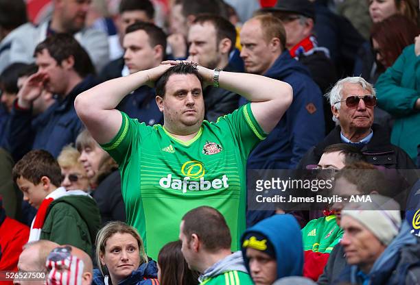Dejected Sunderland supporter looks on during the Barclays Premier League match between Stoke City and Sunderland at Britannia Stadium on April 30,...