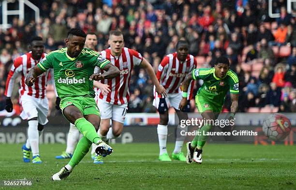 Jermain Defoe of Sunderland converts the penalty to score his team's first goal during the Barclays Premier League match between Stoke City and...