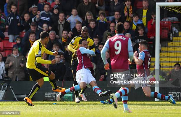 Troy Deeney of Watford scores his team's third goal during the Barclays Premier League match between Watford and Aston Villa at Vicarage Road on...
