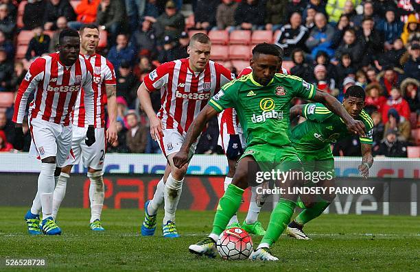 Sunderland's English forward Jermain Defoe scores the equalising 1-1 goal during the English Premier League football match between Stoke City and...